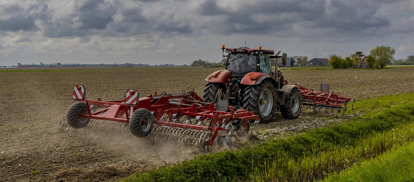 Tractor with implement in field